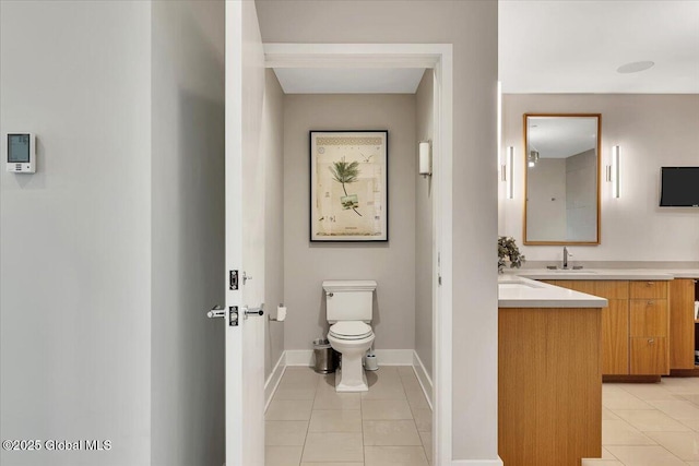 268 Broadway Unit 607, Saratoga Springs, Inside, NY 12866 - bathroom featuring tile patterned floors, vanity, toilet, and baseboards
