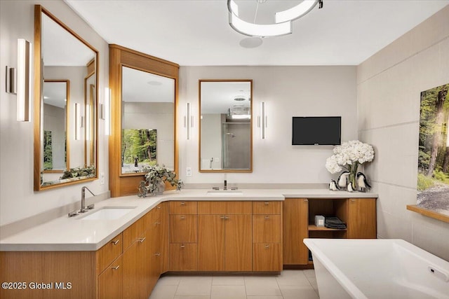 268 Broadway Unit 607, Saratoga Springs, Inside, NY 12866 - bathroom with double vanity, a freestanding bath, and tile patterned flooring