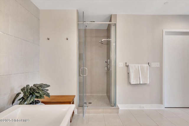 268 Broadway Unit 607, Saratoga Springs, Inside, NY 12866 - bathroom featuring a soaking tub, a shower stall, tile patterned floors, and baseboards