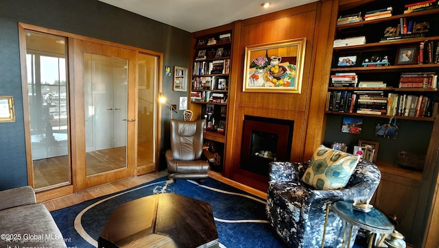 268 Broadway Unit 607, Saratoga Springs, Inside, NY 12866 - sitting room featuring built in features and wood finished floors