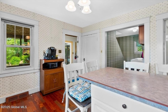 92 Fiddlers Ln, Colonie, NY 12110 - dining space with wallpapered walls, dark wood-style flooring, and a chandelier