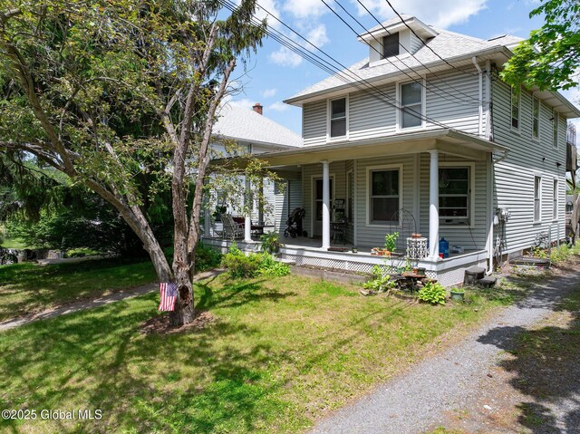 3 Grove St, Bethlehem, NY 12054 - view of front of house with covered porch and a front yard