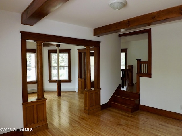3 Grove St, Bethlehem, NY 12054 - spare room featuring beam ceiling, plenty of natural light, light wood-style flooring, and baseboards