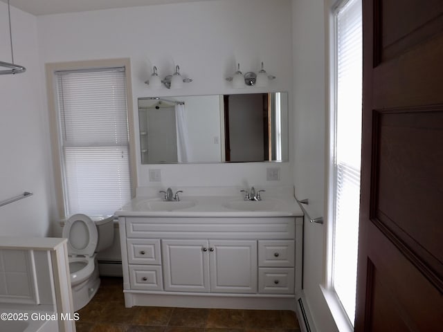 3 Grove St, Bethlehem, NY 12054 - bathroom featuring baseboard heating, healthy amount of natural light, toilet, and double vanity