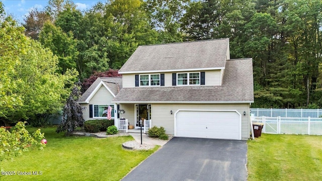 32 Kara Ln, Clifton Park, NY 12065 - view of front of house featuring a garage, a porch, asphalt driveway, and roof with shingles