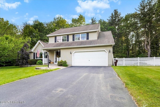 32 Kara Ln, Clifton Park, NY 12065 - view of front of house with driveway, covered porch, and view of scattered trees