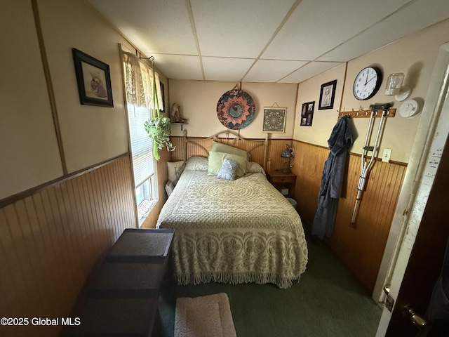 32 5th Ave, Gloversville, NY 12078 - carpeted bedroom featuring a paneled ceiling, wainscoting, and wooden walls