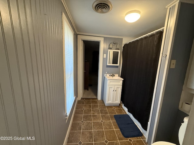 32 5th Ave, Gloversville, NY 12078 - bathroom with vanity, tile patterned flooring, toilet, ornamental molding, and curtained shower