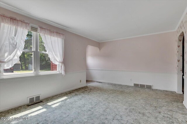 327 Sullivan Rd, Schenectady, NY 12304 - unfurnished room with arched walkways, carpet flooring, crown molding, and baseboards