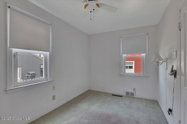 327 Sullivan Rd, Schenectady, NY 12304 - carpeted empty room with a ceiling fan and baseboards