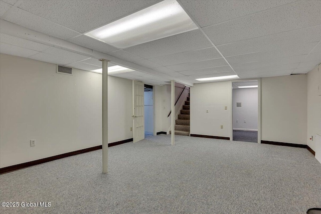327 Sullivan Rd, Schenectady, NY 12304 - finished below grade area with stairway, a drop ceiling, carpet floors, and baseboards