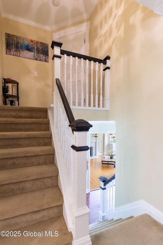 1269 Hawthorn Rd, Niskayuna, NY 12309 - stairway with crown molding and wood finished floors