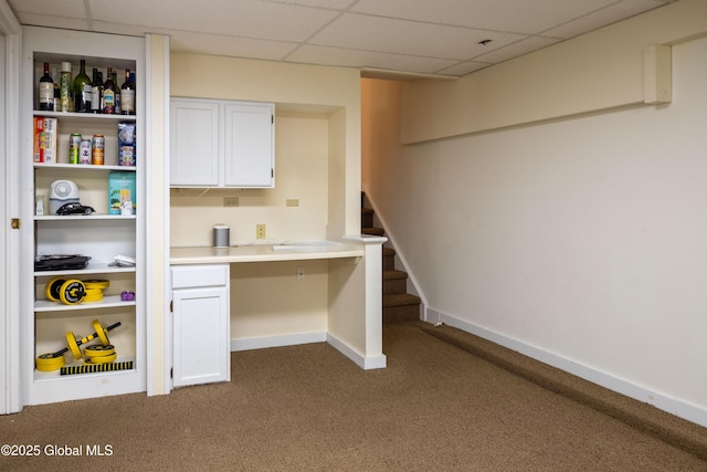 1269 Hawthorn Rd, Niskayuna, NY 12309 - bar featuring a drop ceiling, carpet flooring, built in study area, and stairway