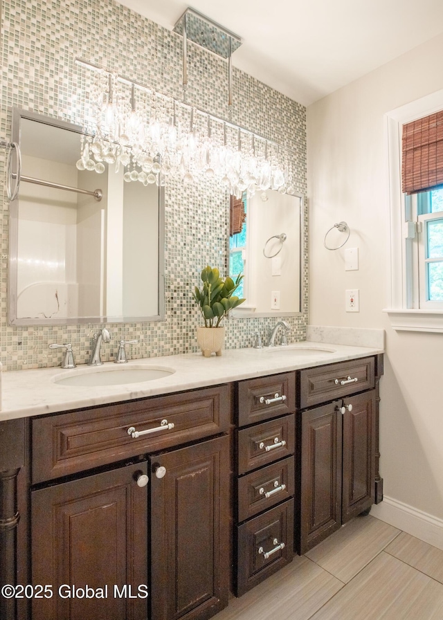 1269 Hawthorn Rd, Niskayuna, NY 12309 - full bathroom with double vanity and backsplash