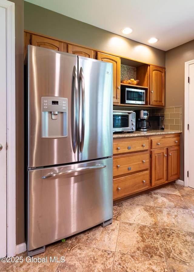 1269 Hawthorn Rd, Niskayuna, NY 12309 - kitchen with appliances with stainless steel finishes, brown cabinets, decorative backsplash, and open shelves
