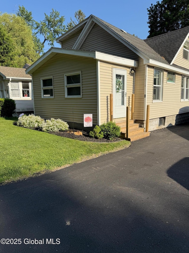 3516 Consaul Rd, Schenectady, NY 12304 - view of front of house featuring a front lawn and roof with shingles