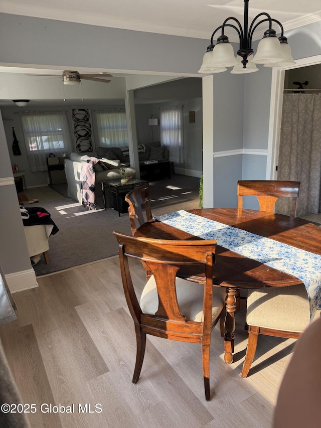 3516 Consaul Rd, Schenectady, NY 12304 - dining space featuring wood finished floors, ornamental molding, and a chandelier