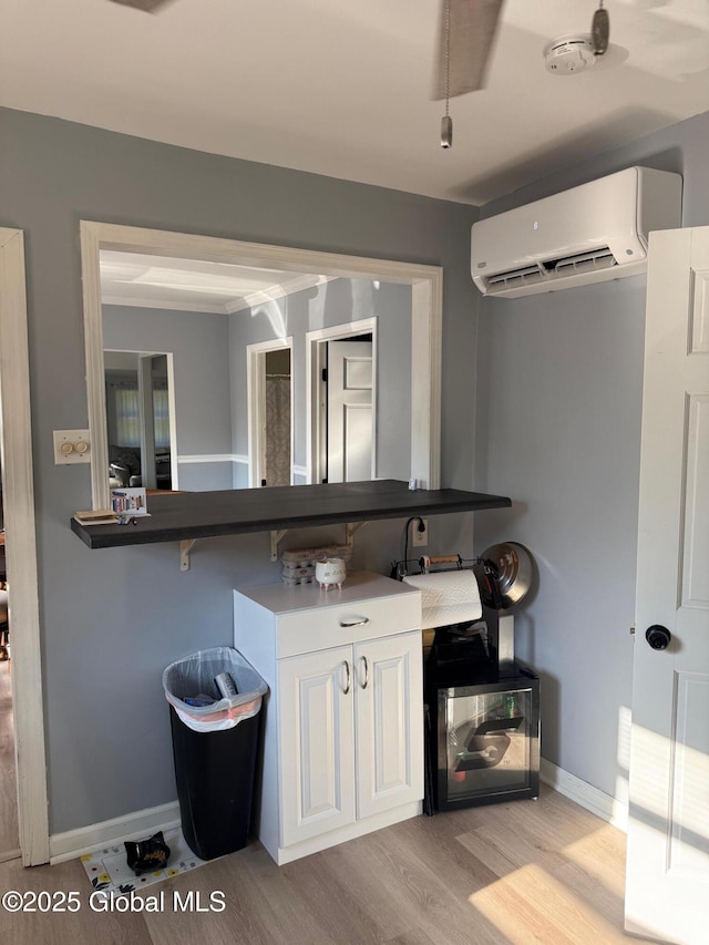3516 Consaul Rd, Schenectady, NY 12304 - bathroom featuring a wall mounted AC, wood finished floors, and baseboards