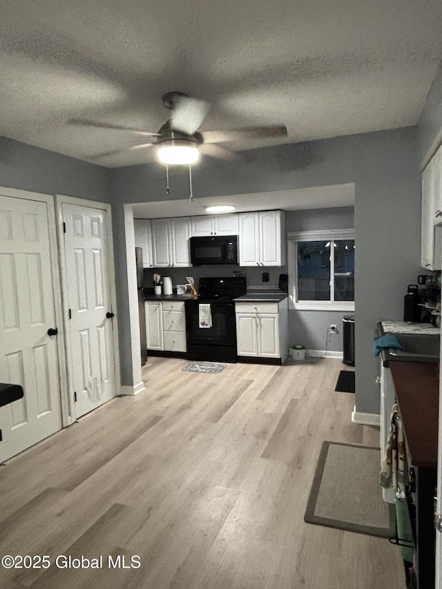 3516 Consaul Rd, Schenectady, NY 12304 - kitchen featuring black appliances, dark countertops, a ceiling fan, light wood finished floors, and a textured ceiling