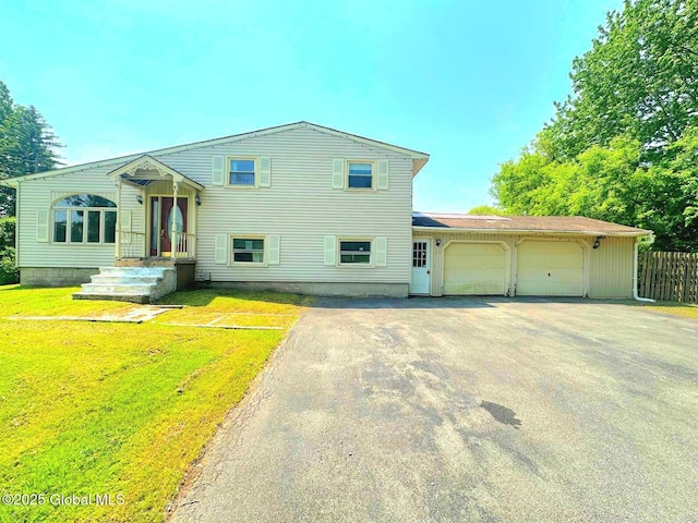 6770 Obrien Rd, Rome, NY 13440 - tri-level home featuring asphalt driveway and a garage
