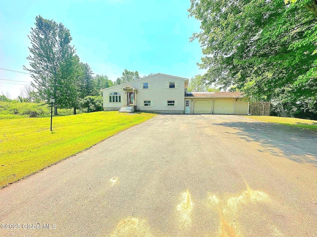 6770 Obrien Rd, Rome, NY 13440 - view of front facade featuring asphalt driveway, an attached garage, and a front yard