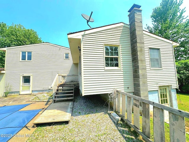 6770 Obrien Rd, Rome, NY 13440 - rear view of house with a chimney and a wooden deck