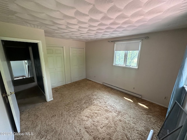 6770 Obrien Rd, Rome, NY 13440 - unfurnished bedroom with a baseboard heating unit, carpet, multiple closets, and baseboards