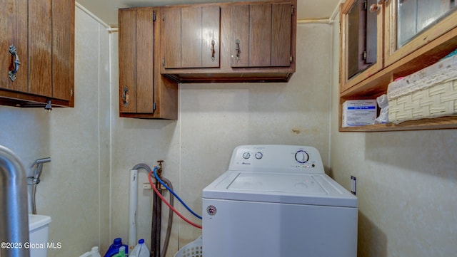 16 Caroline St, Amsterdam, NY 12010 - laundry room featuring washer / clothes dryer and cabinet space
