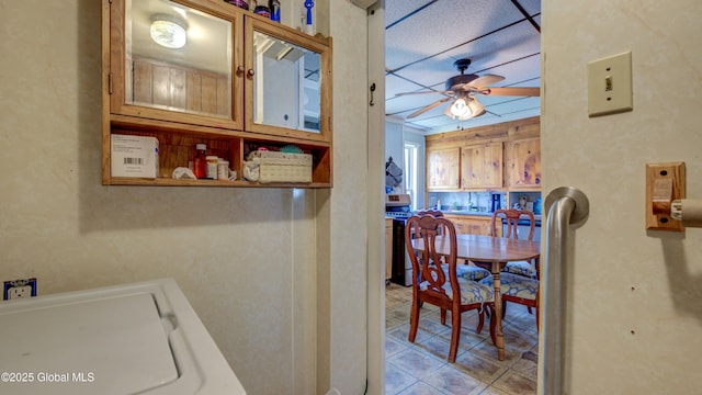 16 Caroline St, Amsterdam, NY 12010 - laundry area with ceiling fan and tile patterned flooring