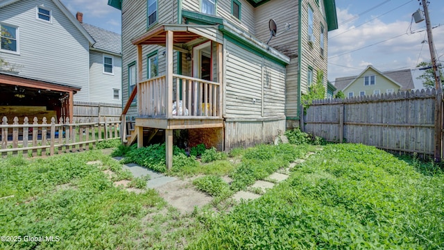 16 Caroline St, Amsterdam, NY 12010 - view of home's exterior featuring a fenced backyard