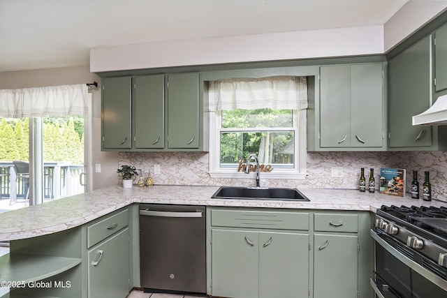 44 St Jude Ln, Glenville, NY 12302 - kitchen featuring dishwasher, a sink, green cabinetry, and decorative backsplash