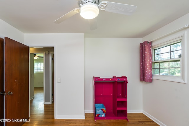 44 St Jude Ln, Glenville, NY 12302 - bedroom with multiple windows, wood finished floors, baseboards, and a ceiling fan