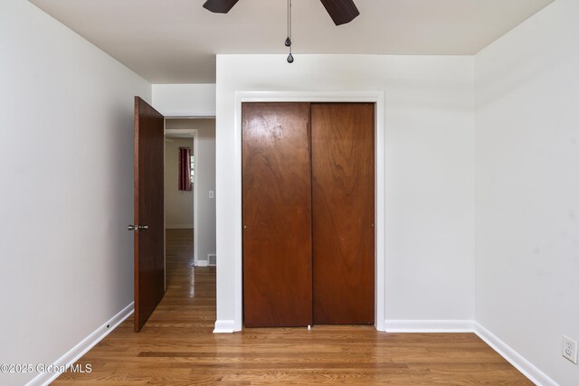 44 St Jude Ln, Glenville, NY 12302 - unfurnished bedroom with a closet, light wood-type flooring, and baseboards
