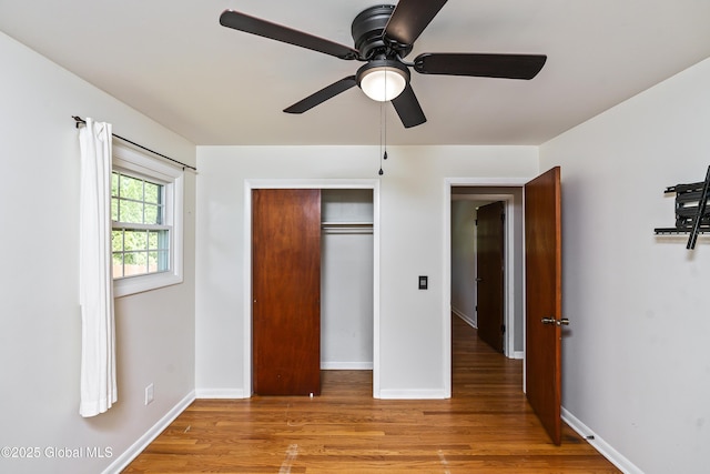 44 St Jude Ln, Glenville, NY 12302 - unfurnished bedroom with light wood-style flooring, a closet, baseboards, and a ceiling fan
