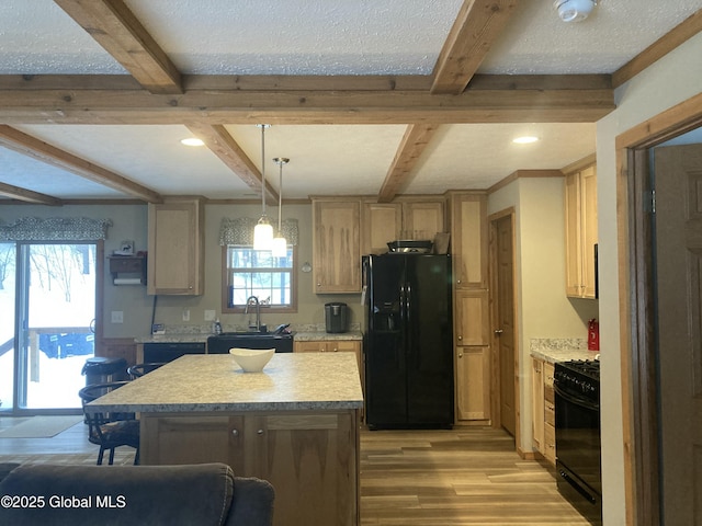 841 Battle Hill Rd, Hague, NY 12836 - kitchen with black refrigerator with ice dispenser, range, light wood-type flooring, light countertops, and beam ceiling