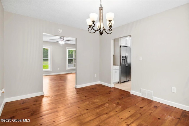 61 Lemaire Way, Argyle, NY 12809 - empty room with a chandelier, ceiling fan, and light wood-style flooring
