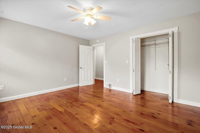 61 Lemaire Way, Argyle, NY 12809 - unfurnished bedroom with hardwood / wood-style floors, ceiling fan, and a closet