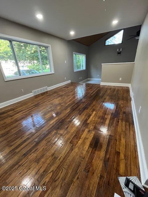 5 Hillandale Dr, Charlton, NY 12019 - unfurnished living room featuring dark wood-type flooring, vaulted ceiling, ceiling fan, and recessed lighting
