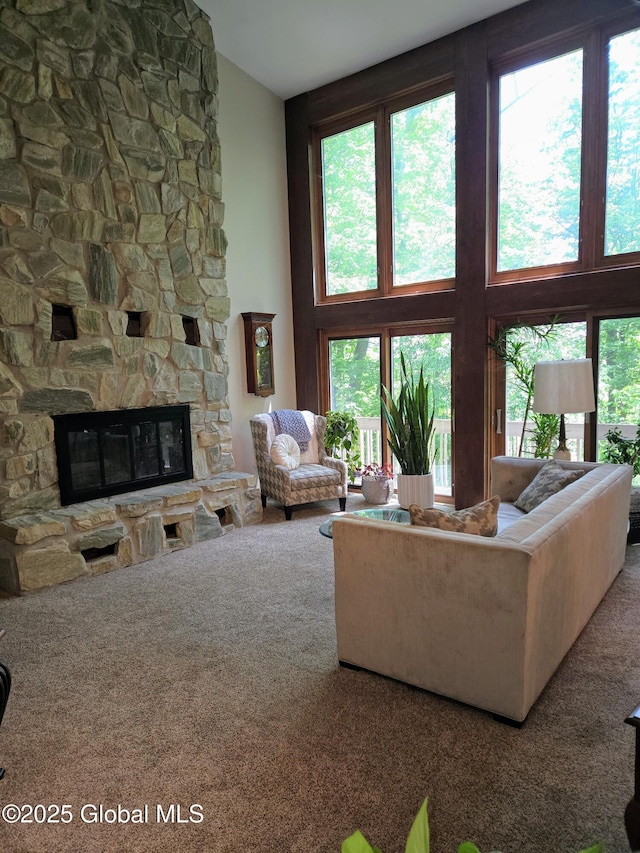 251 Vernon Rd, Glenville, NY 12302 - carpeted living room with healthy amount of natural light, a fireplace, and a towering ceiling