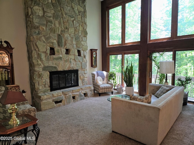 251 Vernon Rd, Glenville, NY 12302 - living room with carpet flooring, a fireplace, healthy amount of natural light, and a high ceiling