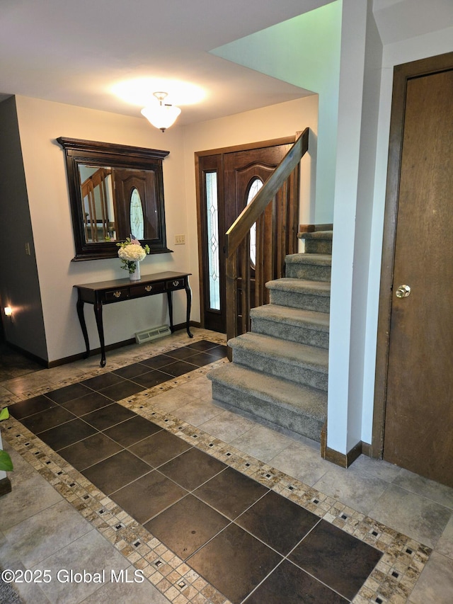 251 Vernon Rd, Glenville, NY 12302 - foyer with tile patterned flooring, stairway, and baseboards