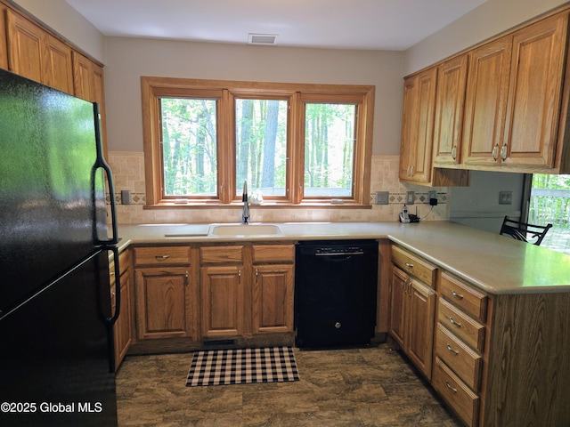 251 Vernon Rd, Glenville, NY 12302 - kitchen with black appliances, a sink, decorative backsplash, and light countertops