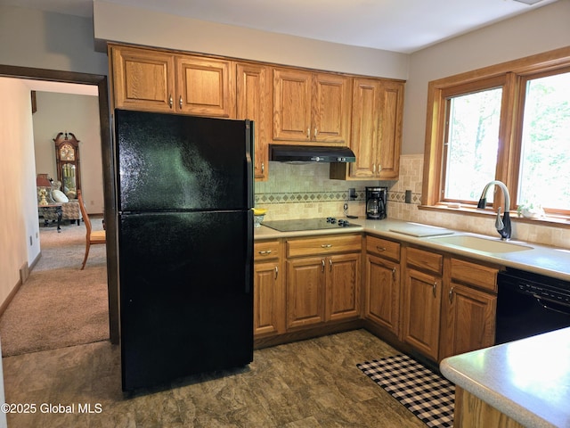 251 Vernon Rd, Glenville, NY 12302 - kitchen with black appliances, under cabinet range hood, a sink, light countertops, and brown cabinetry