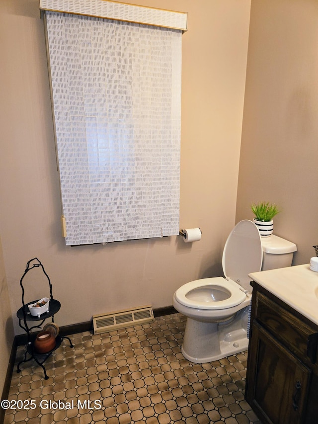 251 Vernon Rd, Glenville, NY 12302 - bathroom with vanity, baseboards, and toilet