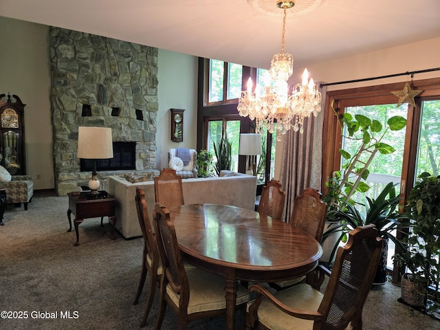 251 Vernon Rd, Glenville, NY 12302 - dining space featuring a chandelier, carpet floors, and a stone fireplace