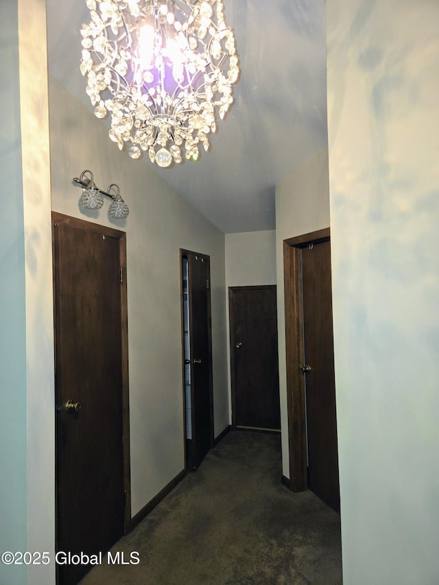 251 Vernon Rd, Glenville, NY 12302 - corridor with a chandelier, dark colored carpet, vaulted ceiling, and baseboards
