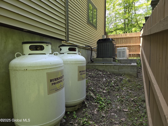 251 Vernon Rd, Glenville, NY 12302 - exterior view of propane tank and central AC unit