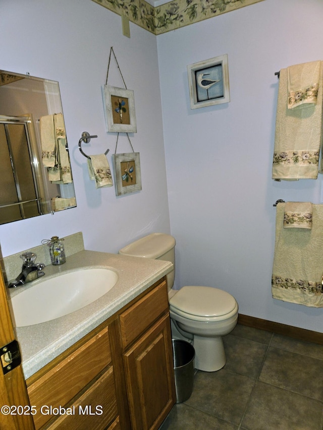 251 Vernon Rd, Glenville, NY 12302 - bathroom featuring vanity, toilet, a stall shower, and tile patterned flooring