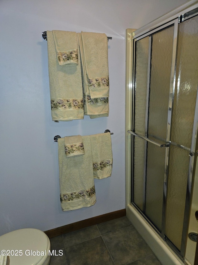 251 Vernon Rd, Glenville, NY 12302 - full bath with baseboards, a stall shower, toilet, and tile patterned floors
