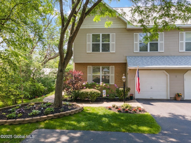1401 Balltown Rd, Niskayuna, NY 12309 - view of front of home featuring driveway, a garage, brick siding, a front yard, and a shingled roof